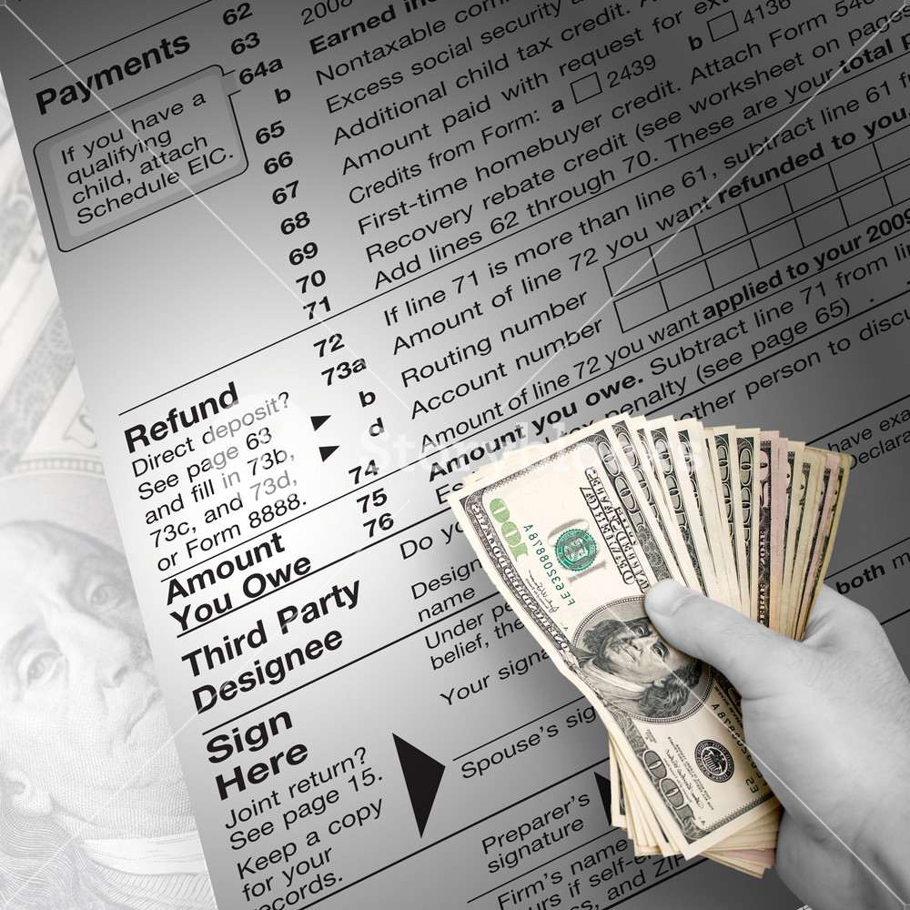 A tax time themed montage for US taxpayers with a hand full of money fanned out.