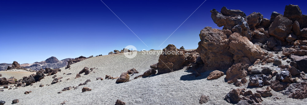 Arid, rocky landscape under a blue sky Royalty-Free Stock Photo SBI ...