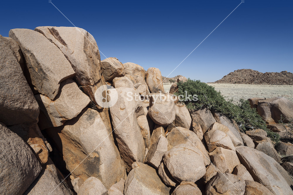 Sun-bleached rocks under a blue sky Royalty-Free Stock Photo SBI ...