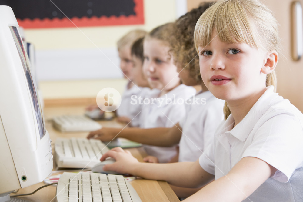 Girl working on a computer at primary school Royalty-Free Stock Photo ...