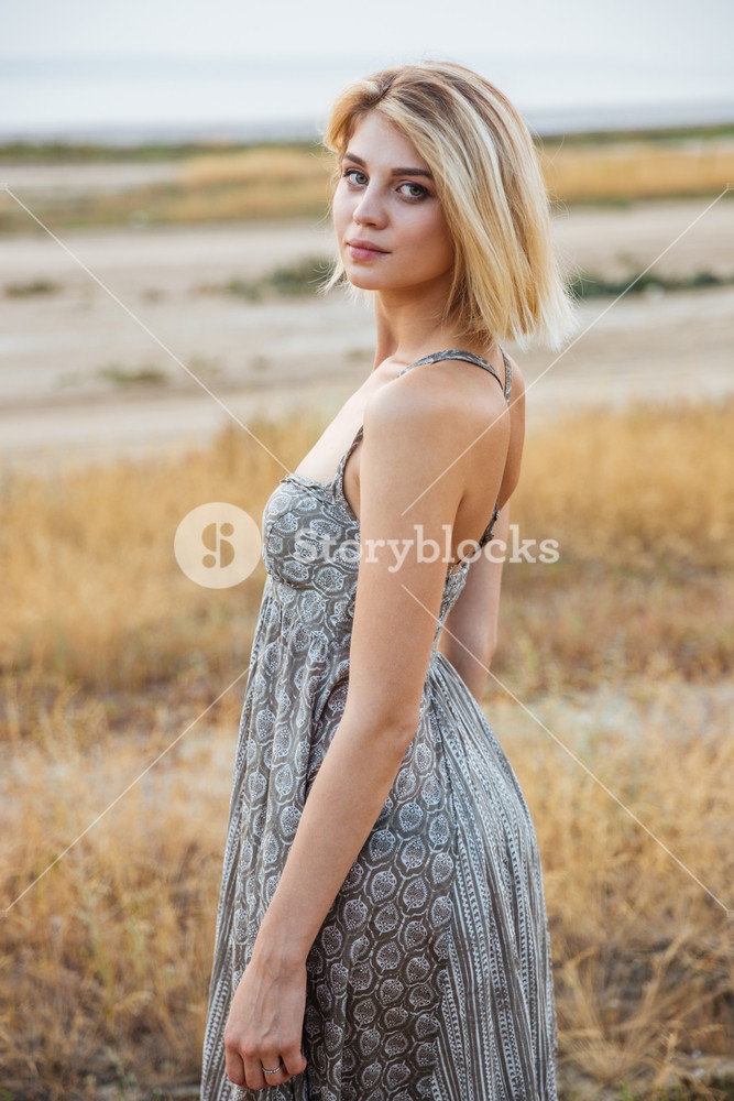 Elegant woman in dress posing outdoors Royalty-Free Stock Photo  SBI-302775083 - Storyblocks