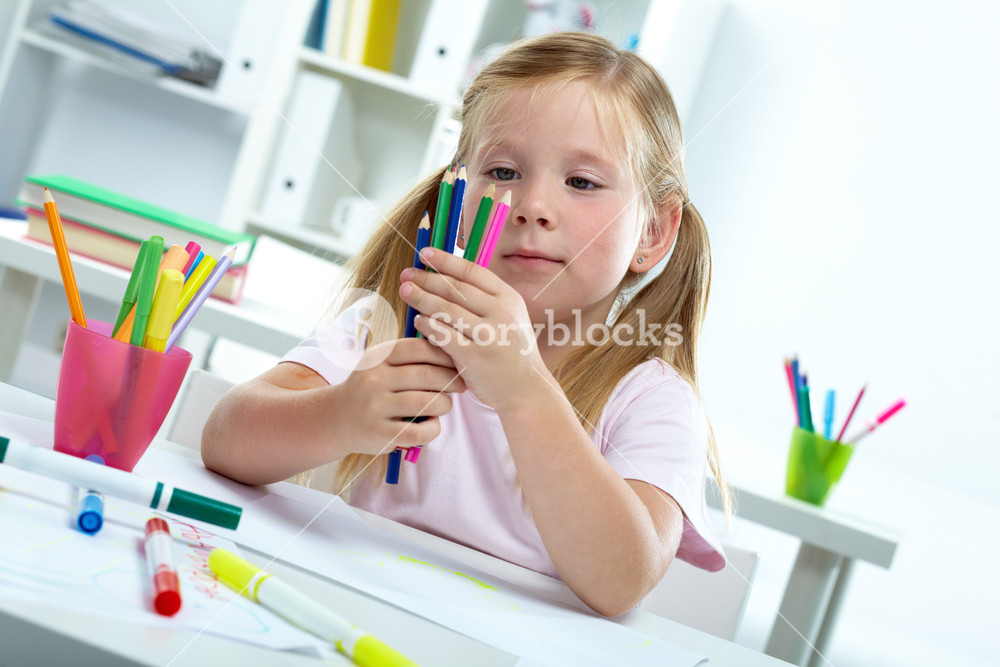 Portrait of a girl with colorful crayons Royalty-Free Stock Photo SBI ...