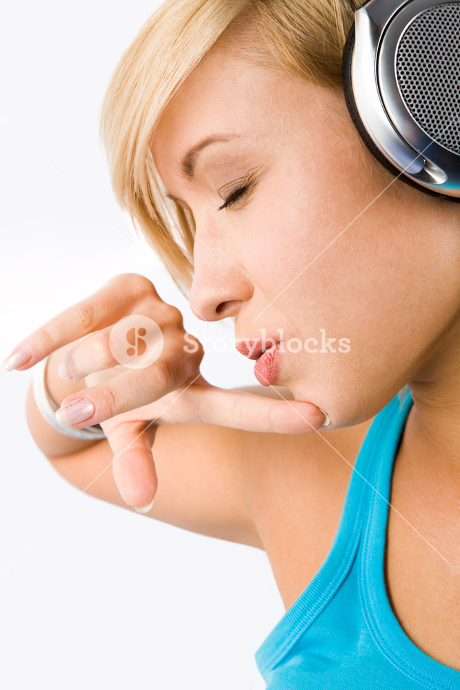 Profile of a thoughtful teenager enjoying music with headphones