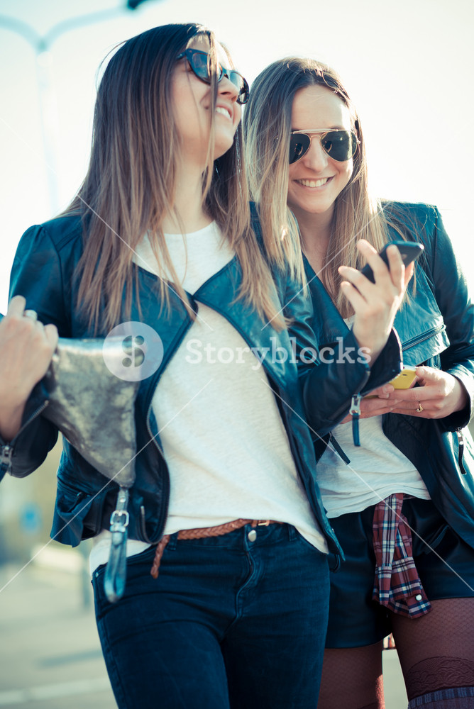 Two stylish young women in the city Royalty-Free Stock Photo SBI ...