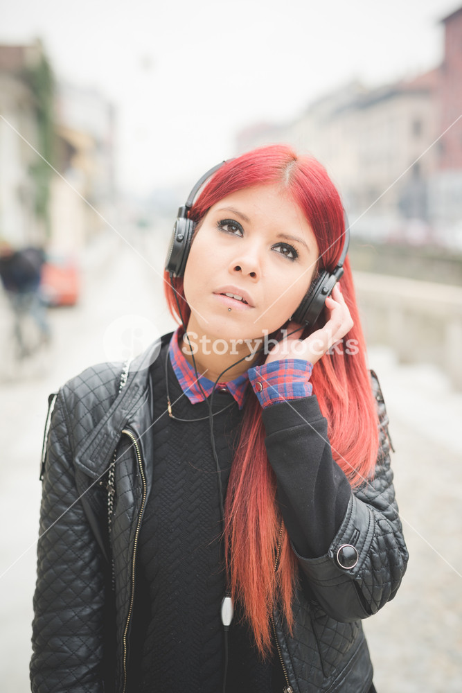 Vibrant Venezuelan Woman Enjoying Milan's City Life with Music