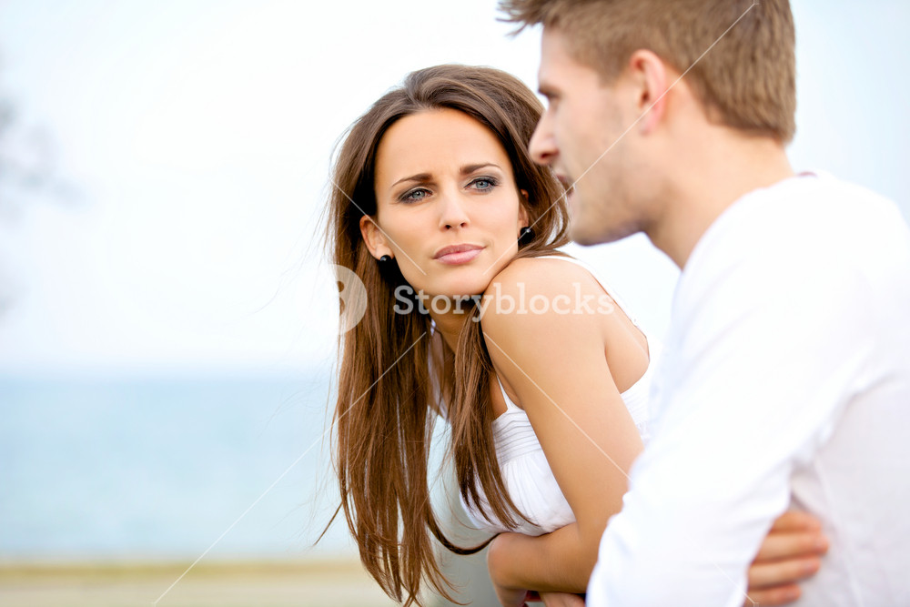 Portrait of a woman attentively listening to her partner on a date