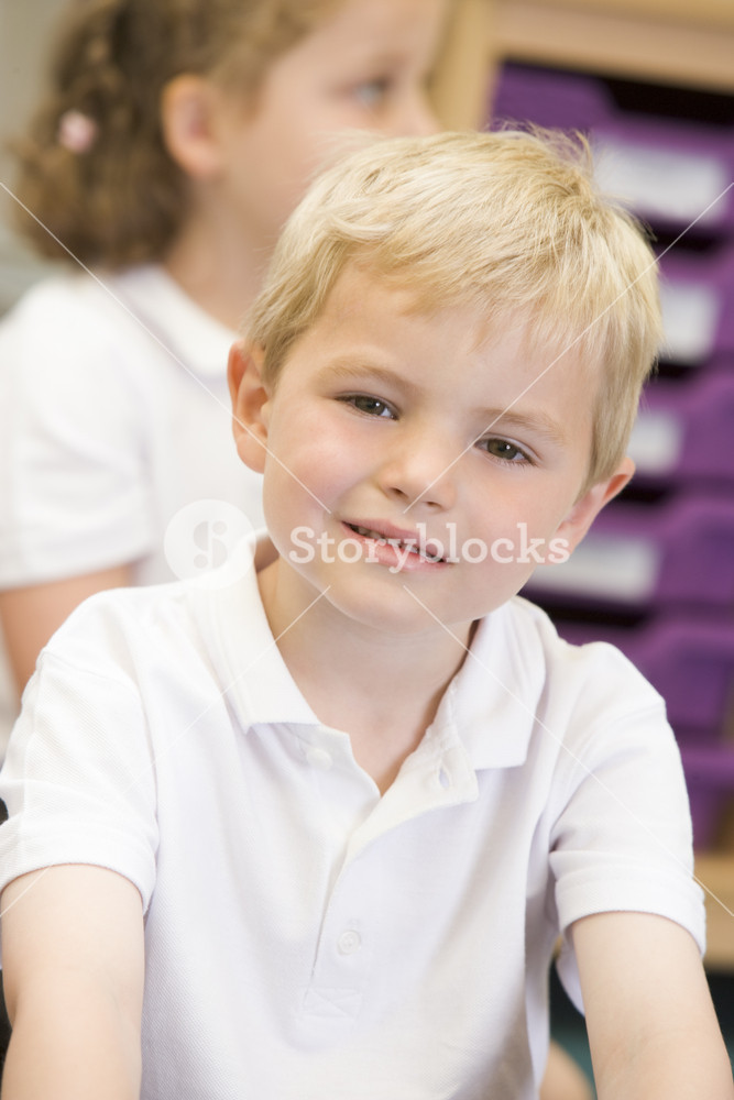 Schoolboy sitting in primary class Royalty-Free Stock Photo SBI ...