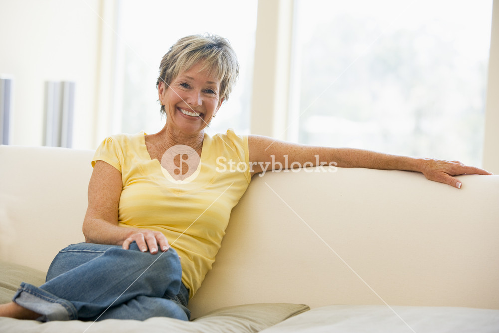 Woman in living room smiling Royalty-Free Stock Photo SBI-301052179 ...