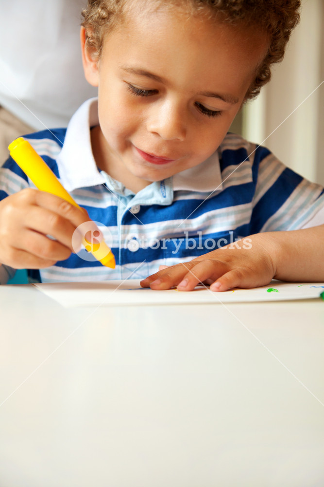 Young child engaged in art activity indoors Royalty-Free Stock Photo ...