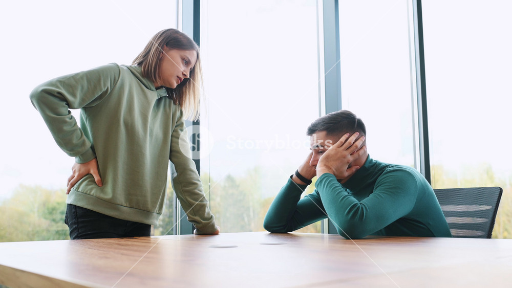 Dramatic Scene Young Couple Arguing. Domestic Violence and Emotional abuse Scene, Stressed Woman and Man Screaming at Each other near the window of Apartment