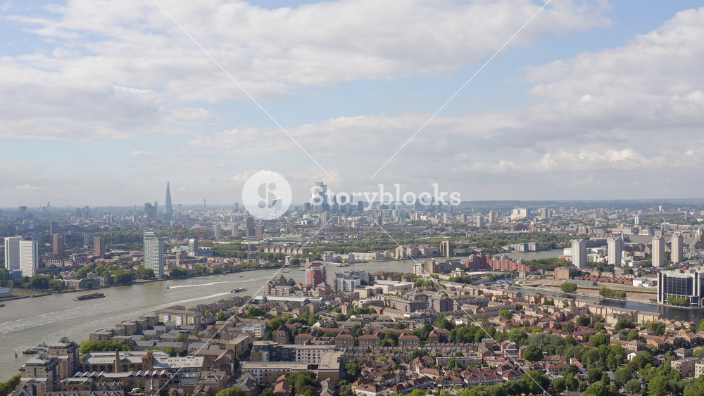London, UK - September 11 2022 - Panoramic view of London, the United Kingdom's capital city, a mixture of traditional mid-rises housing and modern high-rise architecture, aerial shot.