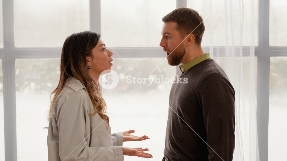 Domestic Violence and Emotional Abuse Scene, Stressed Woman and Aggressive Man Screaming at Each Other in Living Room