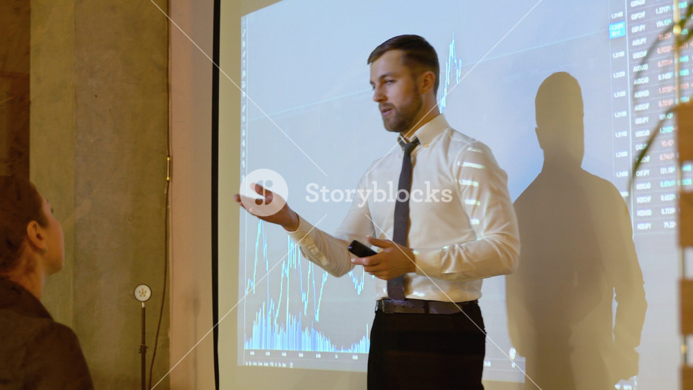 Business speaker is discussing with participants in the meeting of the prospect of growth or falling the cryptocurrency market