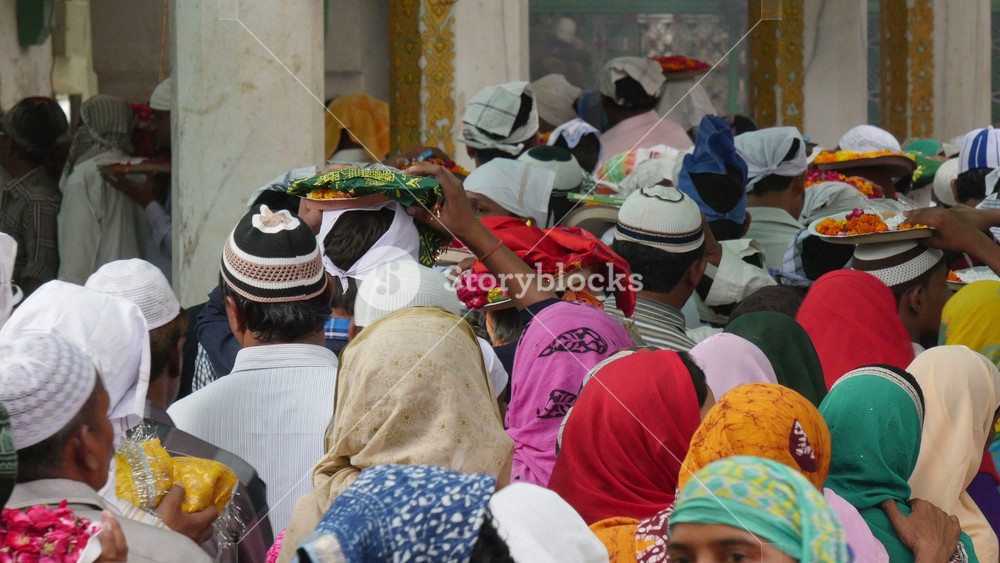 AJMER, INDIA OCTOBER 2014: Sunni Muslims wait in line to read verses of the Quran during Muharram commemorations inside the Dargah shrine in Ajmer, Islam religion in India