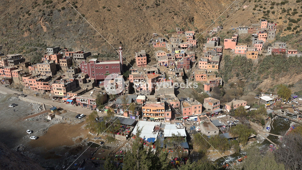 ATLAS MOUNTAINS, MOROCCO DECEMBER 2016: The muezzin calls for (Friday) prayer in a small village in the Atlas mountains, religion and rural life in Morocco