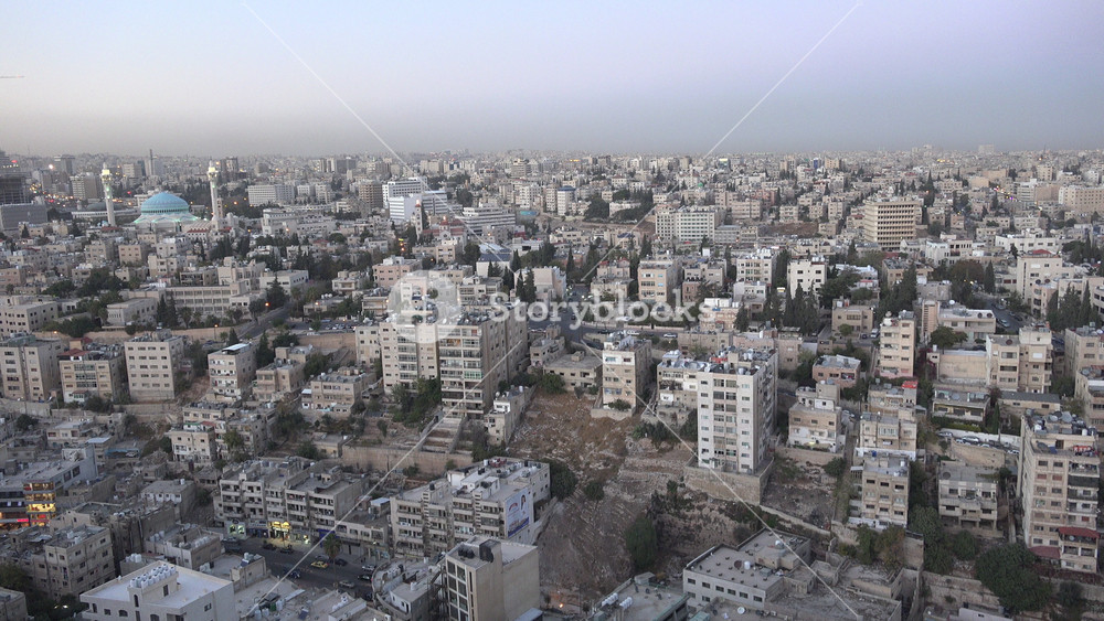 AMMAN, JORDAN NOVEMBER 2016: The muezzins of Amman call for prayer as the last light has disappeared over the city, Islamic religion in the Middle East