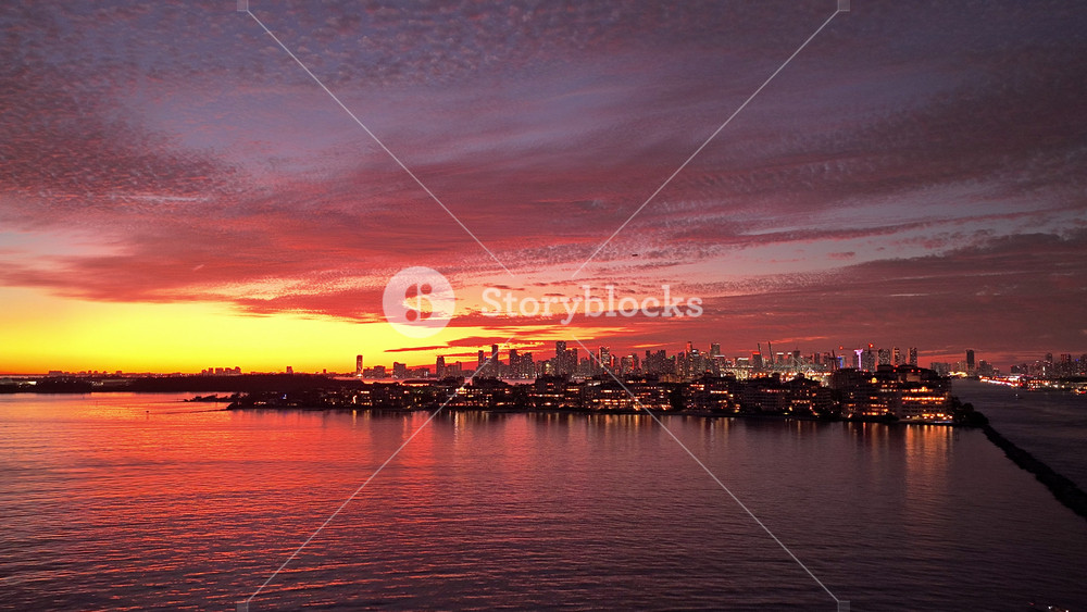 City skyline view. Sunrise cityscape, Florida. Sunset dramatic sky Miami city. Seascape with cityscape on sunset. Night cityscape of Miami