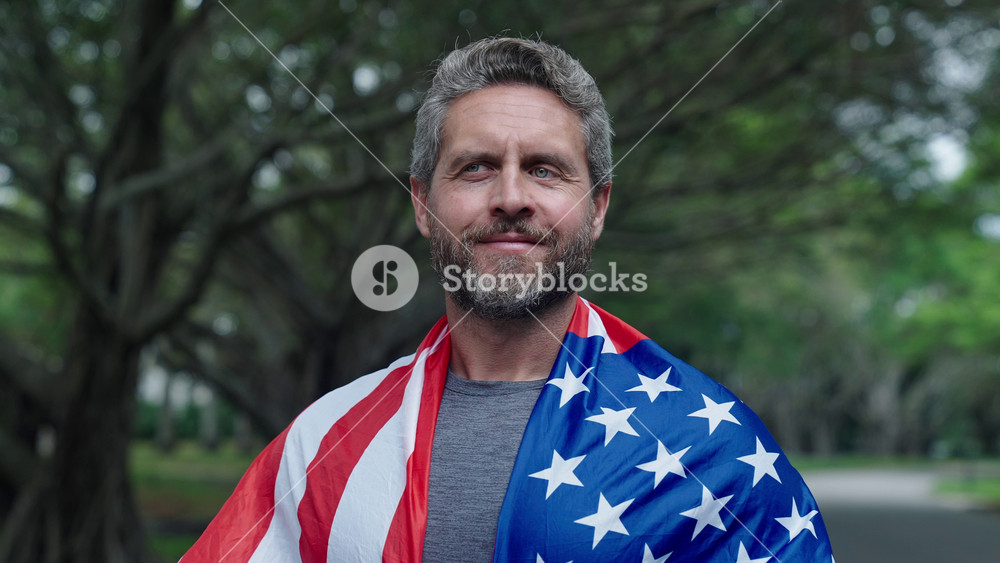 4th of July. Man feel proud with American flag outdoor. Patriot man with patriotic symbol. American independence. National flag