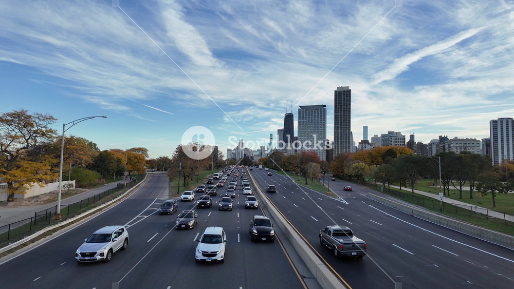 Chicago, Illinois, USA - July 24, 2025: Car traffic on the road highway. Autumn city highway. Urban traffic. Road way with car. City road