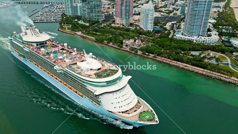 June 8, 2024 - Miami Beach, Florida: Aerial view Cruise ship Freedom of the seas sailing next to Miami South Beach. Cruise liner Freedom of