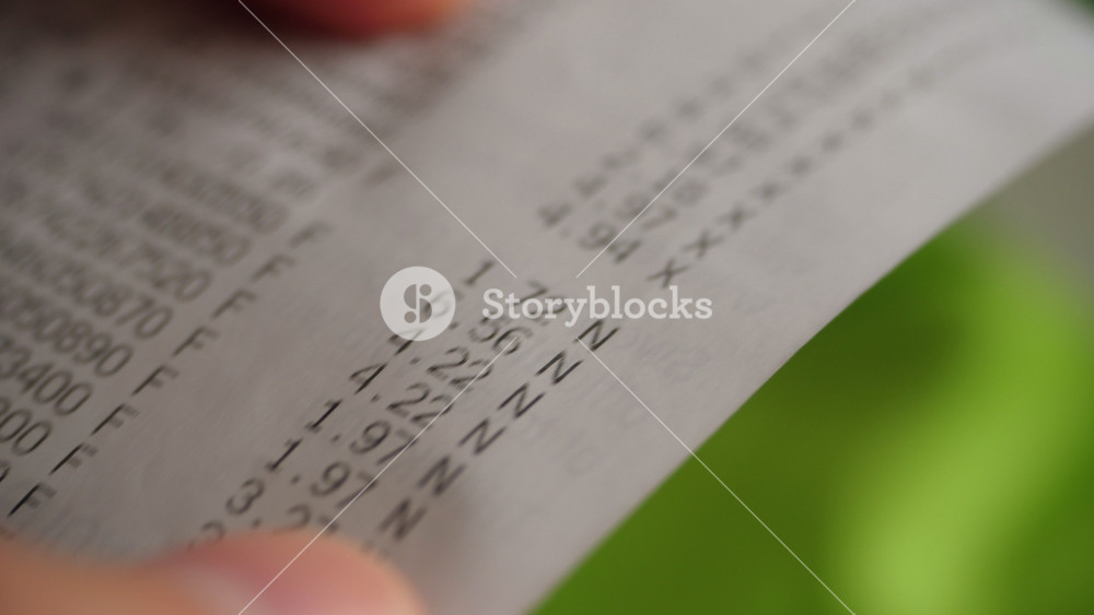 Inflation Economy. Close-up Receipt Person Hands of Shopper Reading Accounting Report After Buying or Purchase Credit. Till Slip Man Holding Finance Document After Buying or Shopping in Supermarket.
