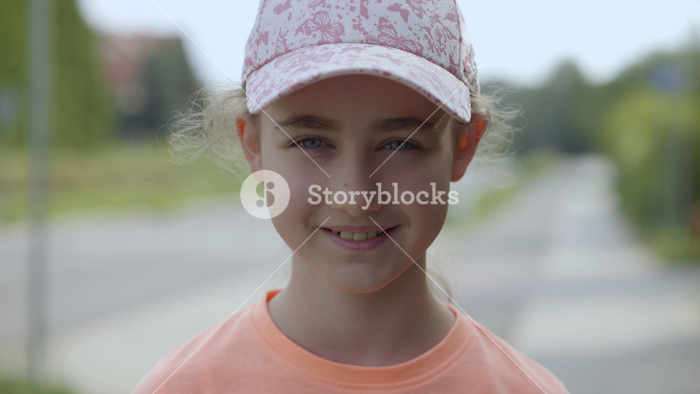 Portrait Smiling Teenage Girl Looking at Camera in Summer Sun Day. Laughs Happily Child at Outdoors. Inquisitive Little Girl Portrait. Happy Face Funny Contemplative Child Smile Freedom and Wellness.