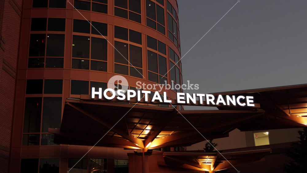 Hospital Entrance with Signage. Emergency Sign at Hospital in USA. Emergency Room and Medical Care Building. Hospital, Medical Center, Emergency Room. Evening Night Times.