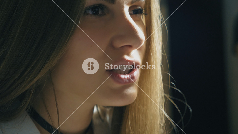 Beautiful girl sings in sound studio. Attractive lady emotionally sings song. Working of creative musician. Show business concept. Slow motion Close up