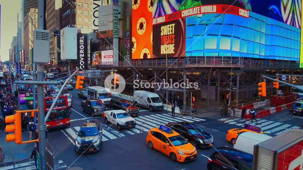New York City - Sept 28, 2018: Times square timelapse with crowded traffic billboard and people. New York City is the most populous city in the United States.