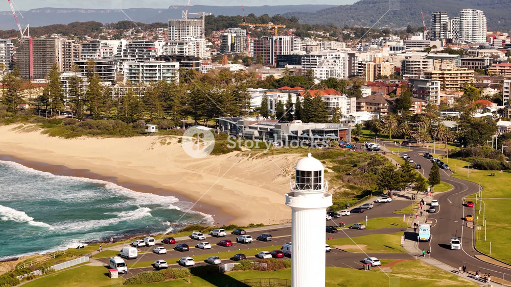Aerial drone view of Wollongong on the NSW South Coast, Australia heading past Flagstaff Point Lighthouse on a sunny day in August 2026