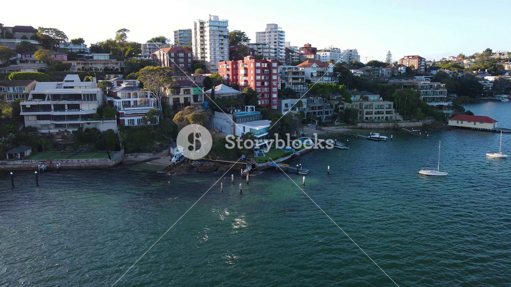 Low aerial drone view of the harbour side suburb of Point Piper in East Sydney, NSW, Australia on a sunny morning in May 2024