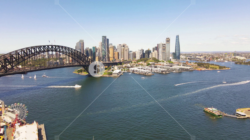 Aerial drone view of Sydney City and Sydney Harbour Bridge in Sydney, NSW Australia looking from Lavender Bay on a sunny day