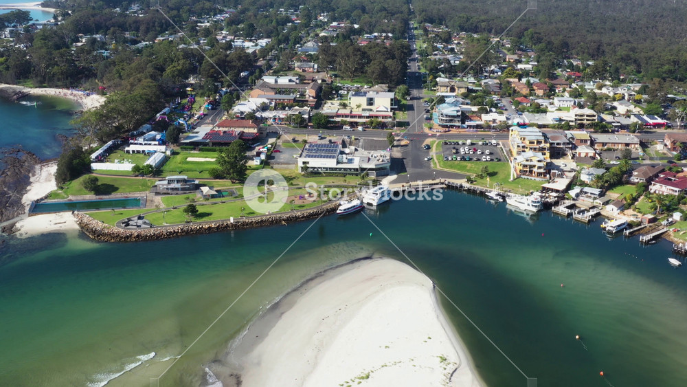 Aerial drone view of Huskisson on the New South Wales South Coast, Australia, showing Currambene Creek and Jervis Bay on a bright sunny day in March 2020