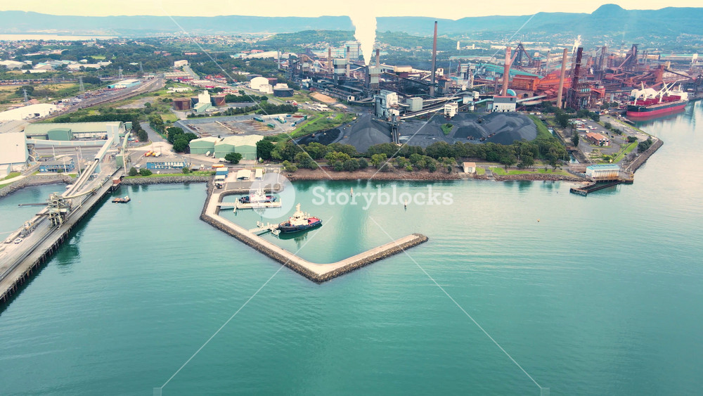 Aerial drone view of Port Kembla, in the Illawarra Region of NSW, Australia showing the seaport and industrial complex in May 2022
