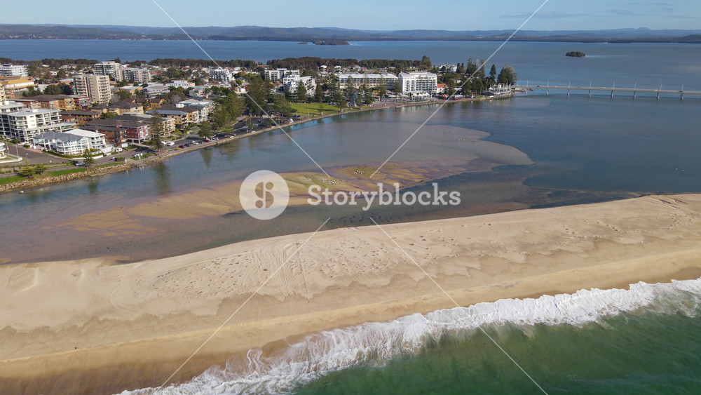 Aerial drone view above The Entrance and Tuggerah Lake on the Brisbane Water of Central Coast, New South Wales, Australia on a sunny morning in September 2023